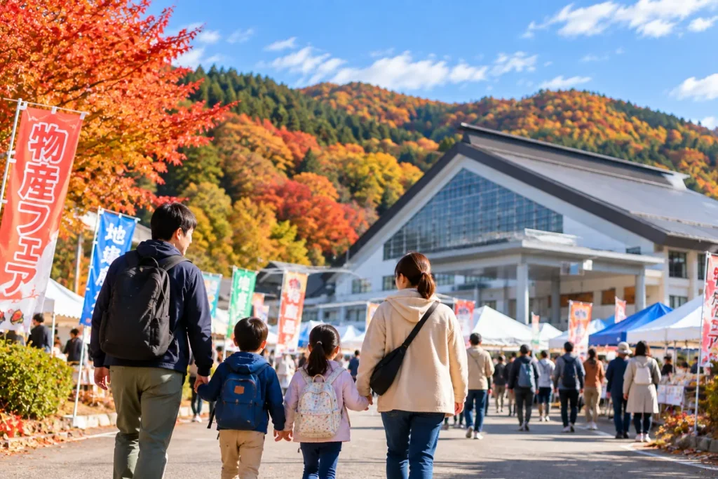 子どもと一緒に物産フェアの会場を歩く家族